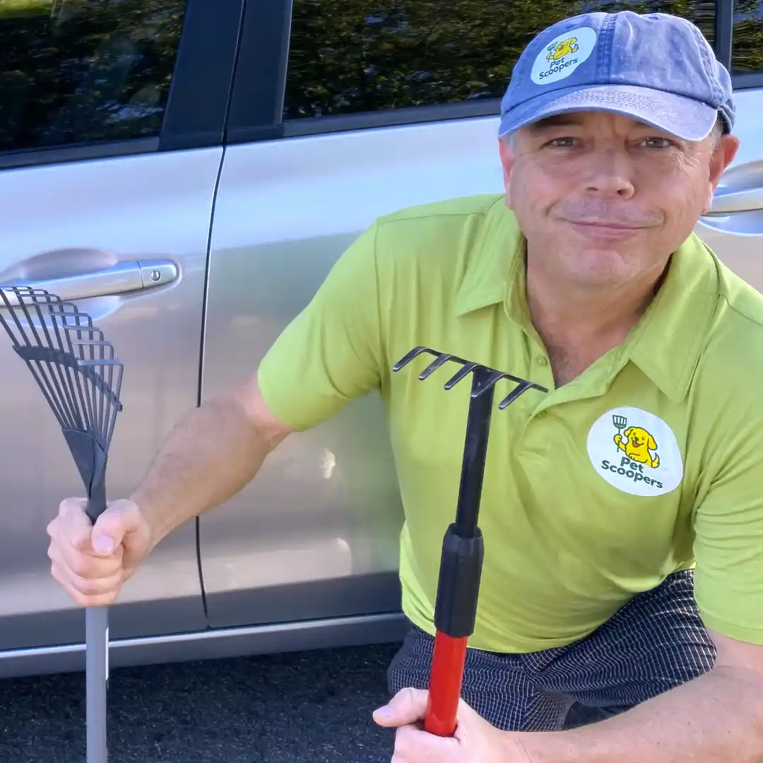 Jim, PetScoopers owner-operator, standing outdoors ready to help keep your yard clean.
